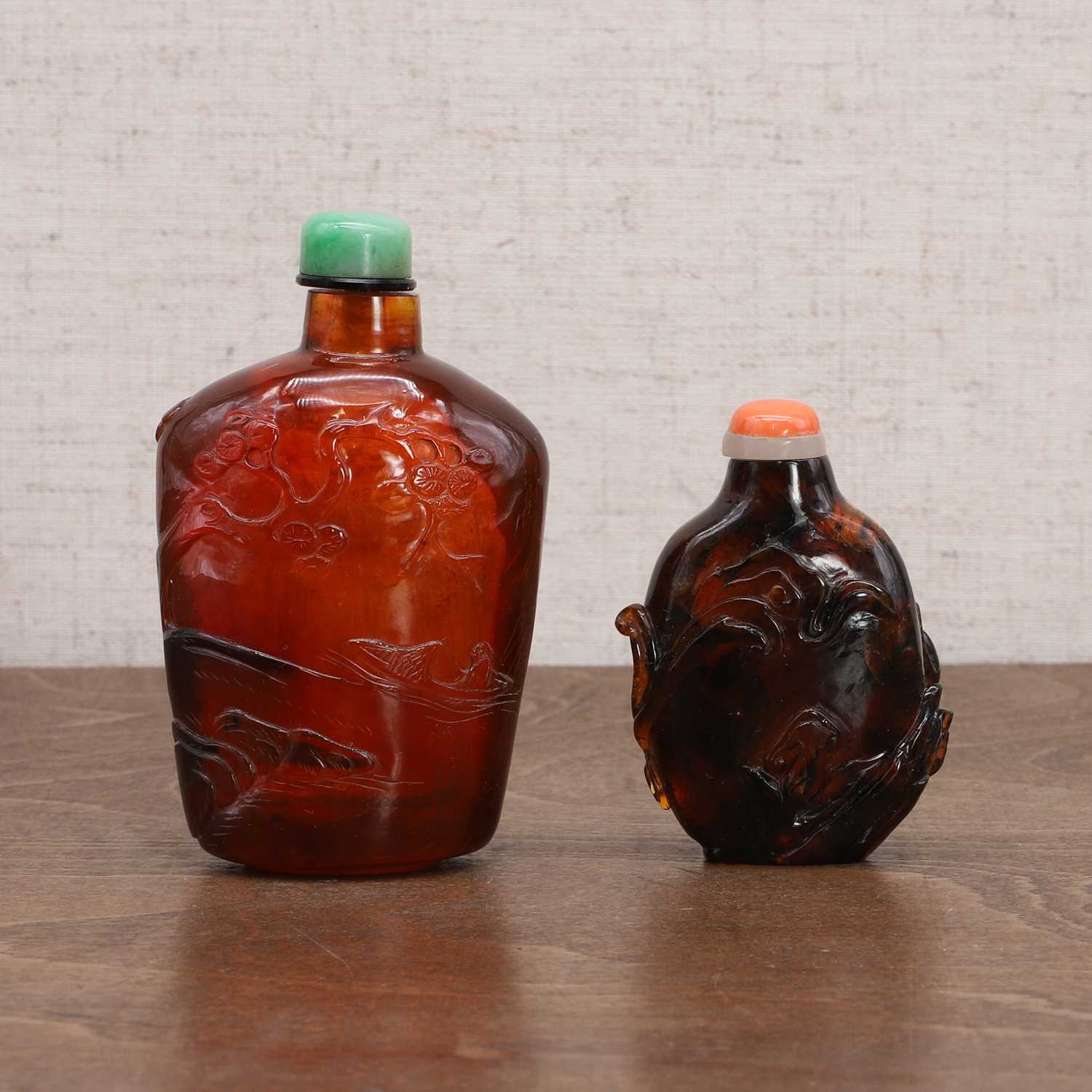 Two Chinese amber snuff bottles,