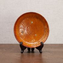 A Chinese amber-glazed saucer,