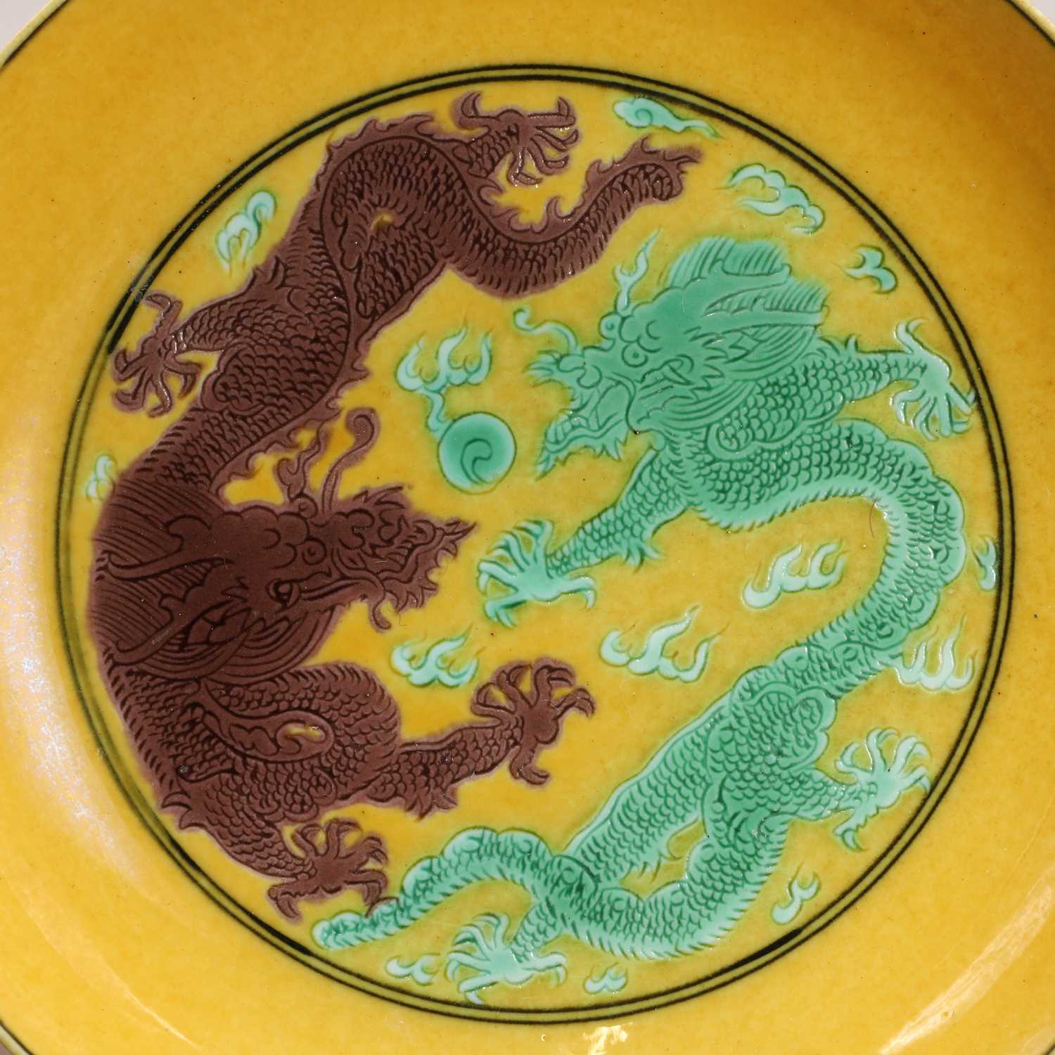A Chinese porcelain yellow-ground saucer dish, - Image 3 of 4