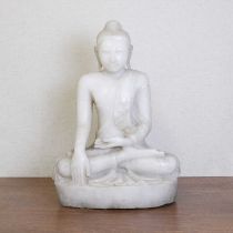 A marble figure of seated Buddha,
