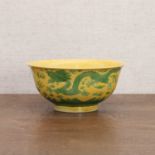 A Chinese yellow-ground green-enamelled bowl,