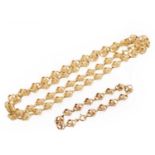 An 18ct gold fancy link necklace and bracelet set, by UnoAErre,