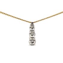 An 18ct gold diamond three stone pendant and chain,