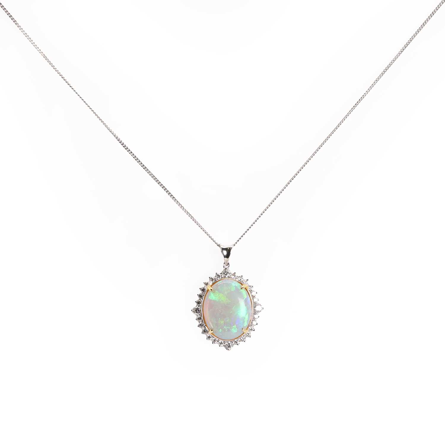 An oval cabochon opal and diamond cluster pendant, - Image 2 of 3