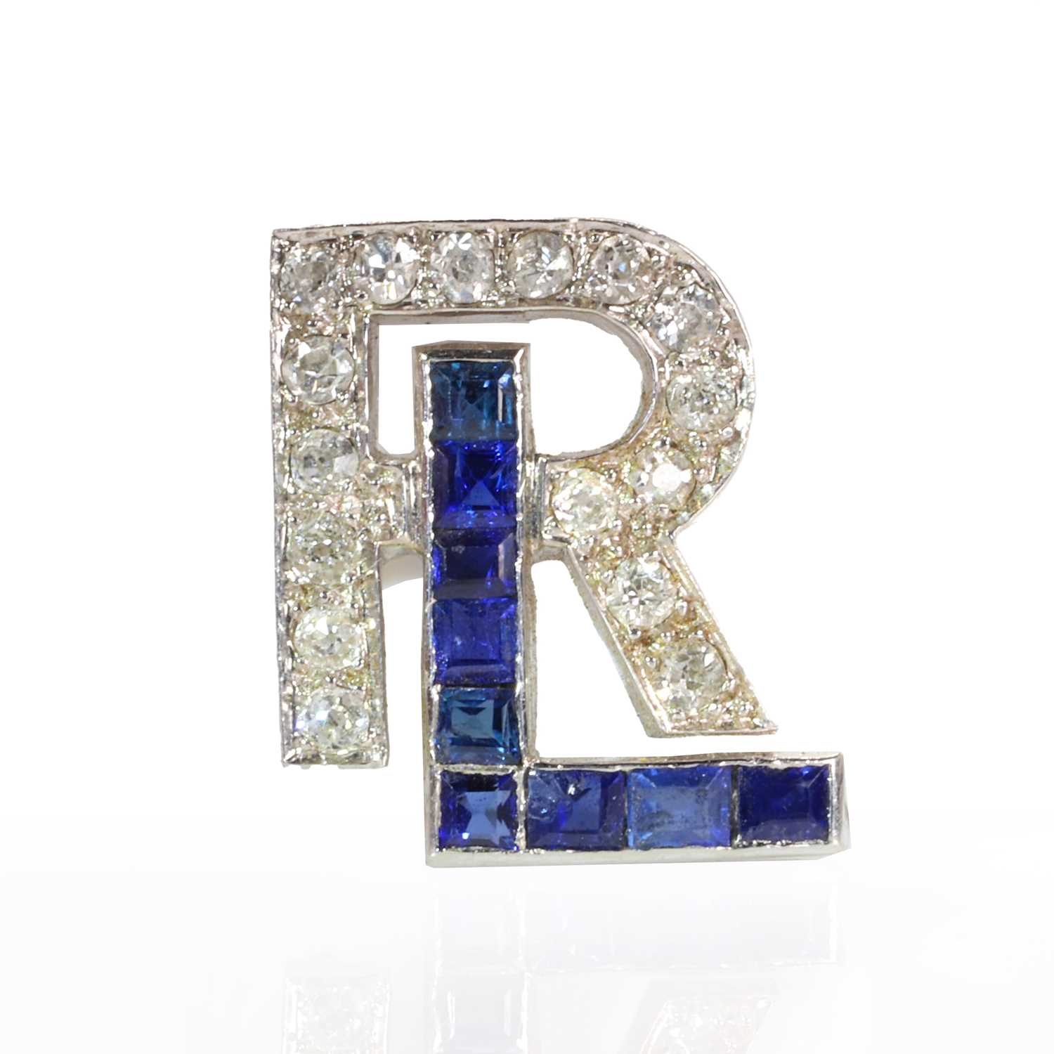 An Art Deco sapphire and diamond monogram,
