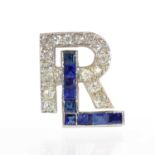 An Art Deco sapphire and diamond monogram,