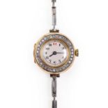 A ladies 18ct gold diamond set mechanical bracelet watch, c.1913,