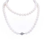 A single row uniform cultured pearl necklace with a diamond set clasp,