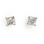 A pair of princess cut diamond stud earrings,