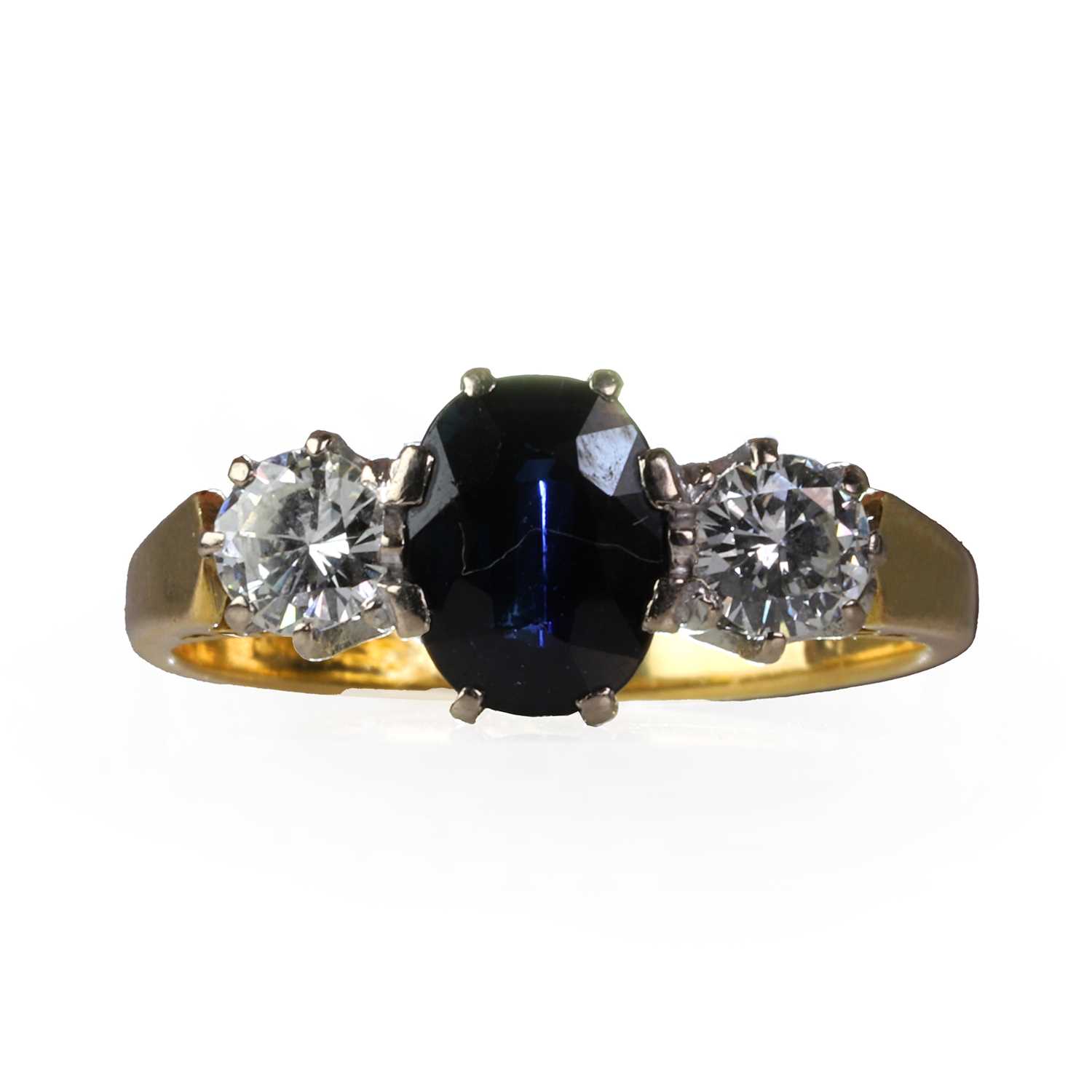 An 18ct gold diamond and sapphire three stone ring,