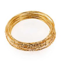 A group of nine plain gold bangles,