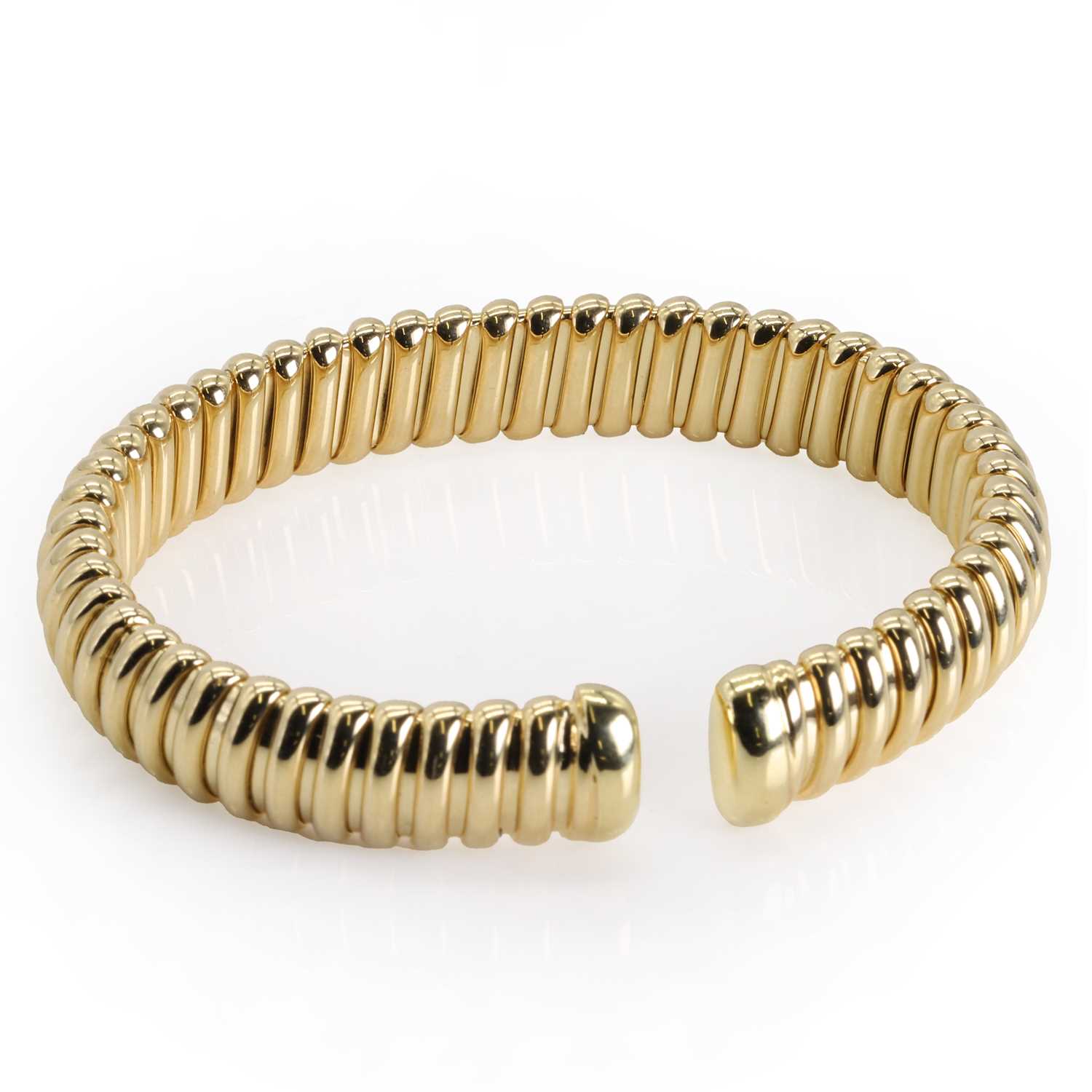 An 18ct gold torque bangle, by Mappin & Webb,