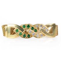 A gold diamond and emerald mesh link bracelet,