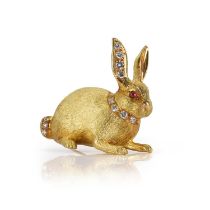 An 18ct gold ruby and diamond rabbit brooch,