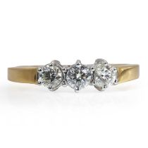 An 18ct gold three stone diamond ring,