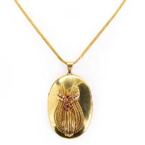 An 18ct gold ruby locket pendant,