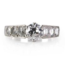 A platinum and diamond ring,