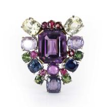 A varicoloured sapphire and amethyst clip brooch, c.1940-1950,