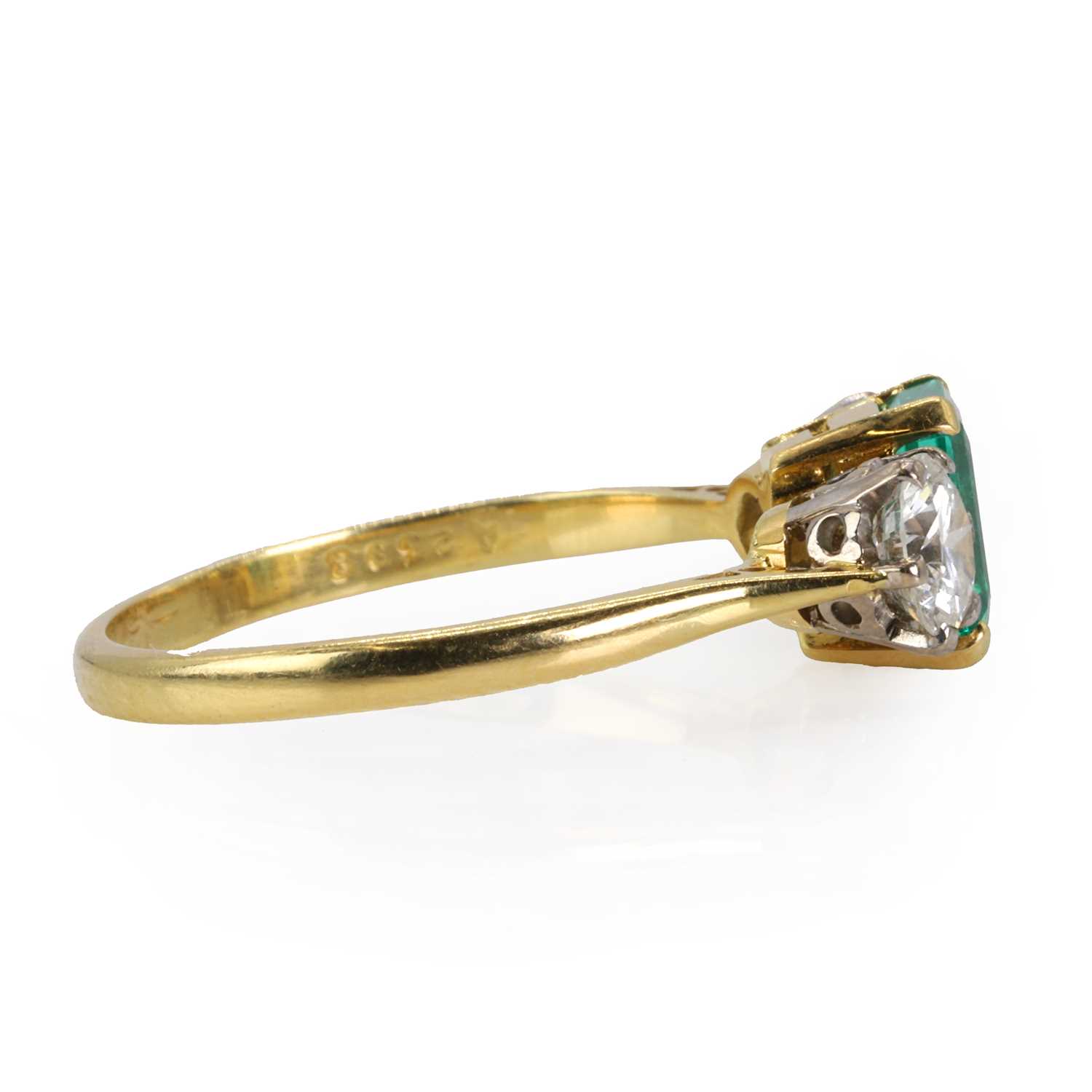 An 18ct gold Colombian emerald and diamond three stone ring, - Image 3 of 3