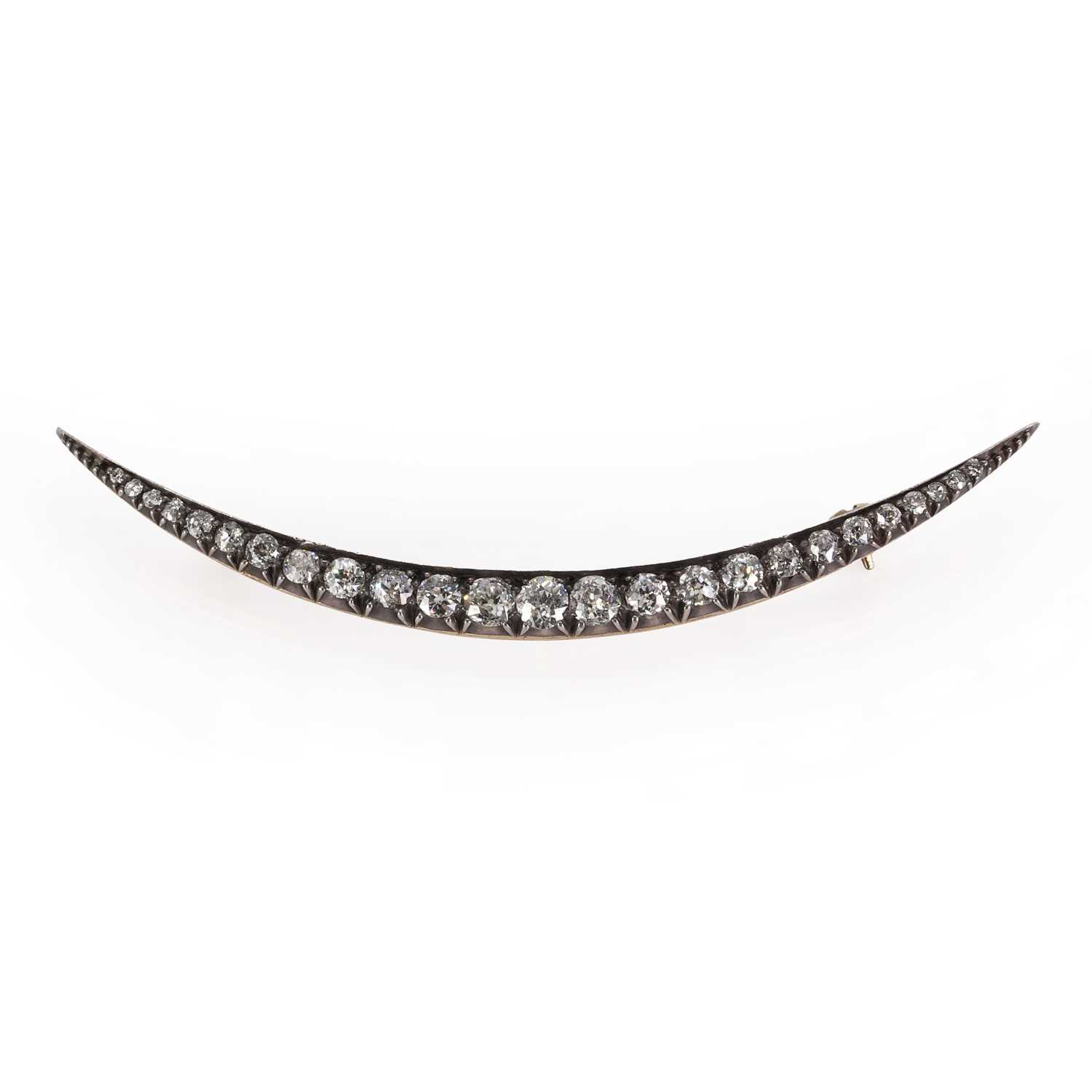 A Victorian diamond crescent brooch,
