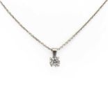 An 18ct white gold single stone diamond pendant and chain,