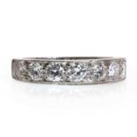 An 18ct white gold half eternity ring,