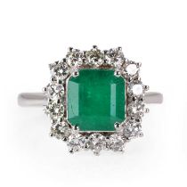 An emerald and diamond cluster ring,