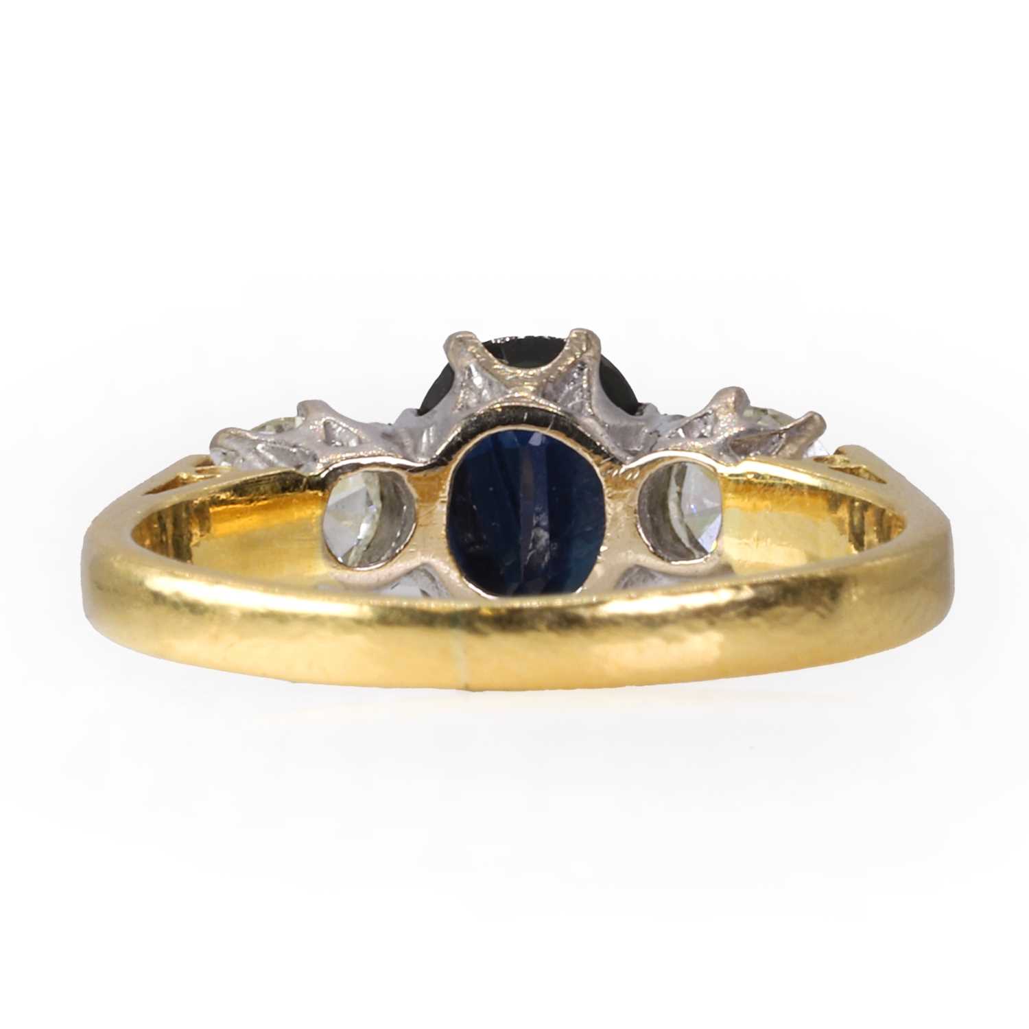 An 18ct gold diamond and sapphire three stone ring, - Image 3 of 4