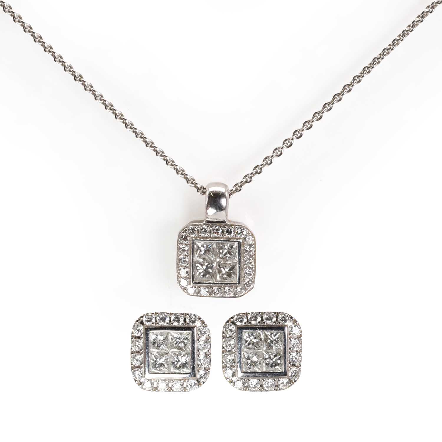 An 18ct white gold diamond pendant and earring set set,