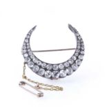 A late Victorian two row diamond closed crescent brooch, c.1890,