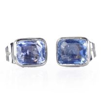 A pair of single stone cornflower blue sapphire stud earrings,