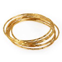 A group of six high carat gold bangles,