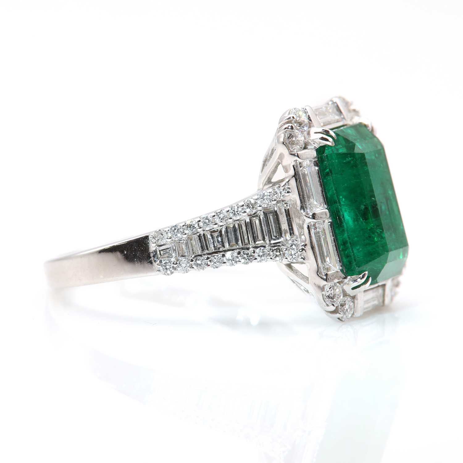 A white gold emerald and diamond cluster ring, - Image 2 of 8