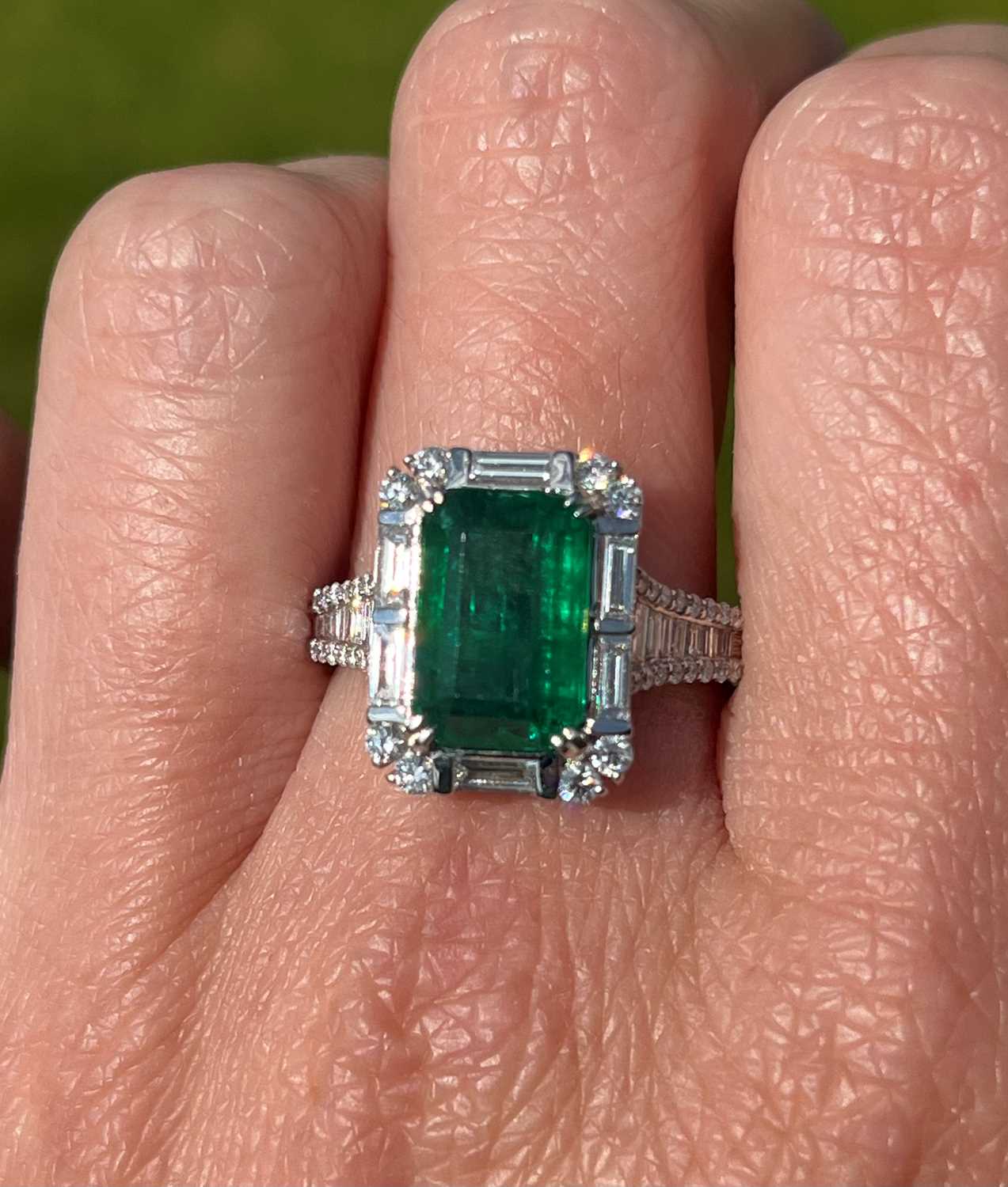 A white gold emerald and diamond cluster ring, - Image 8 of 8