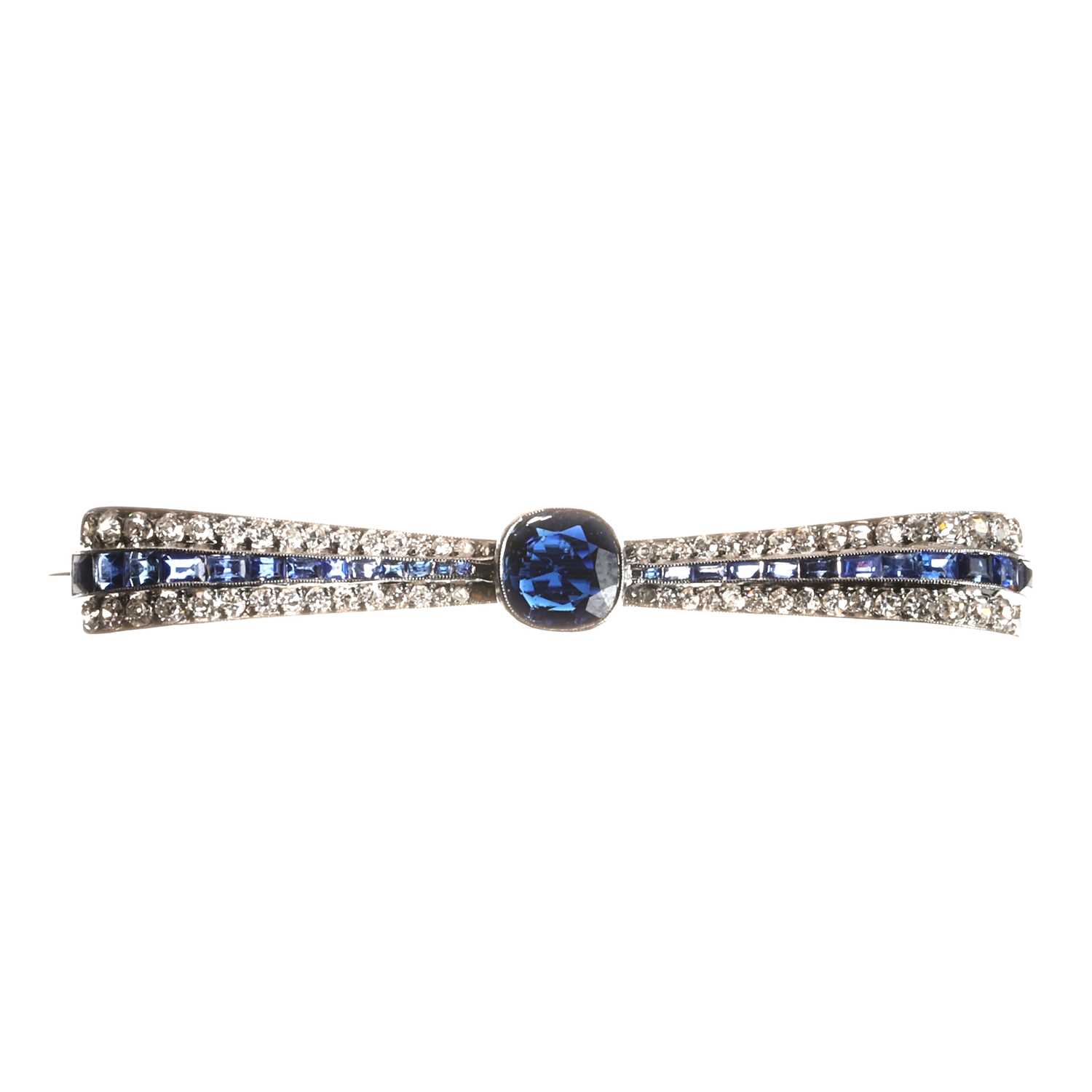 A diamond and sapphire bow brooch, c.1920,