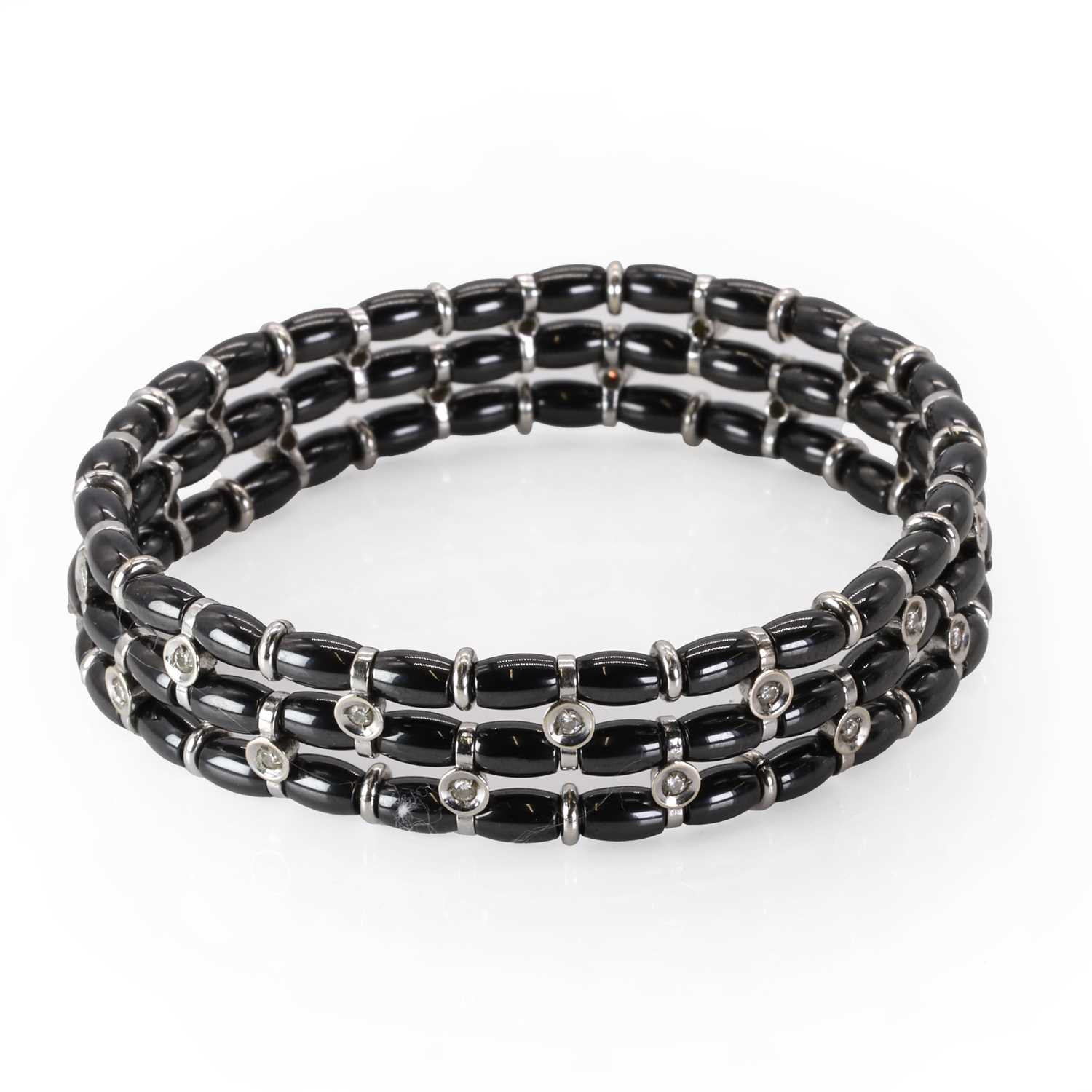 A white gold diamond and black ceramic bead bracelet, by Jarretiere,