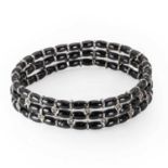 A white gold diamond and black ceramic bead bracelet, by Jarretiere,