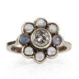 A 9ct gold diamond and moonstone cluster ring,