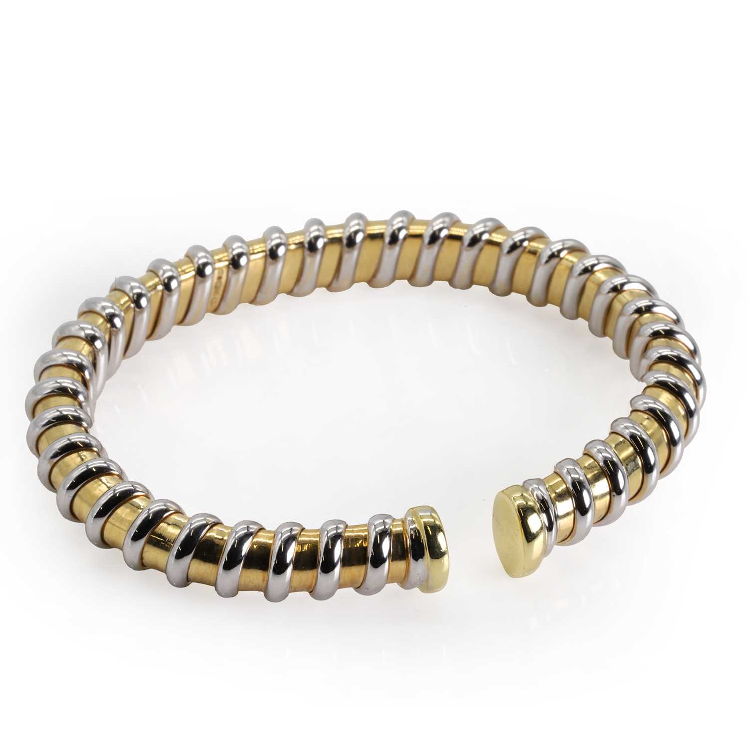 An 18ct bi-colour gold torque bangle,