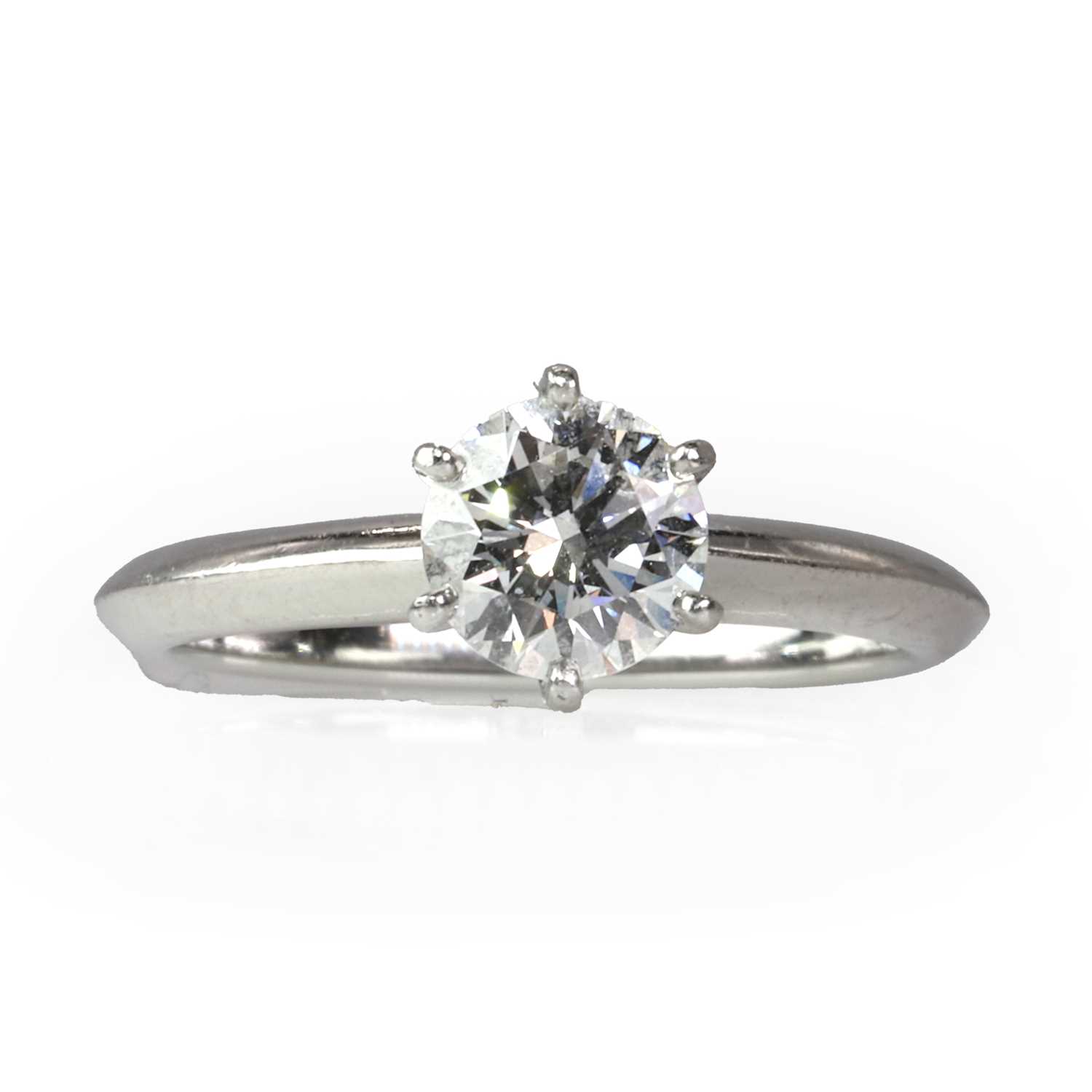 A platinum diamond single stone ring, by Tiffany & Co.,