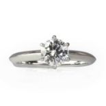 A platinum diamond single stone ring, by Tiffany & Co.,
