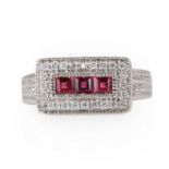 A white gold diamond and rhodolite garnet ring,