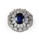 A mid 20th century sapphire and diamond bombé ring,