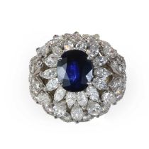 A mid 20th century sapphire and diamond bombé ring,