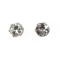 A pair of diamond stud earrings,