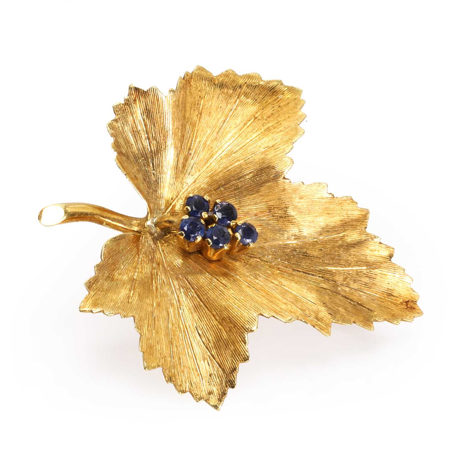 A textured gold sapphire set maple leaf pin, by Tiffany & Co.,