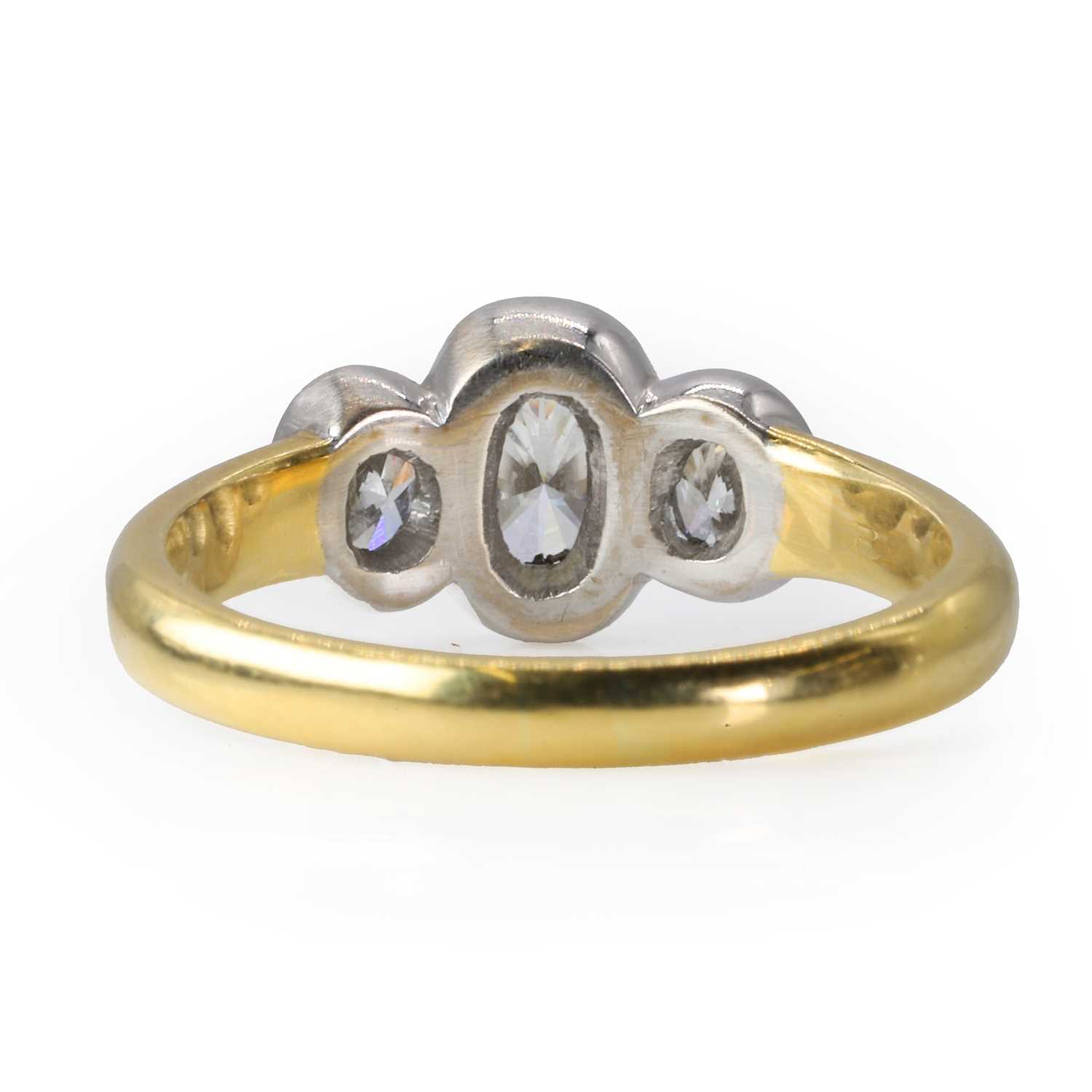 An 18ct gold and oval cut diamond three stone ring, - Image 2 of 3