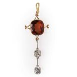 An Edwardian hessonite garnet and diamond pendant,