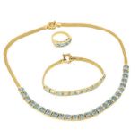 A gold and blue topaz jewellery suite,