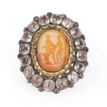 A silver mounted black dot paste and carnelian intaglio brooch,